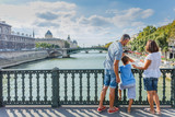 Fototapeta Mapy - Happy family of three enjoying vacation in Paris, France