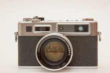 Old classic film photo camera on white background isolated with free space