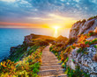 canvas print picture - Dramatic spring sunset on the the cape Milazzo panorama of nature reserve Piscina di Venere.