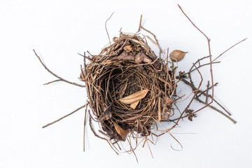 Wall Mural - isolated empty bird's nest with little shadow on white background