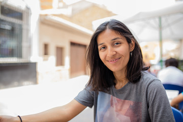 Young indian woman happy and smiling laughing