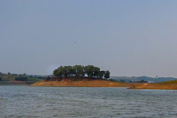 Small island in the middle of the Cacaban reservoir, Tegal, Indonesia