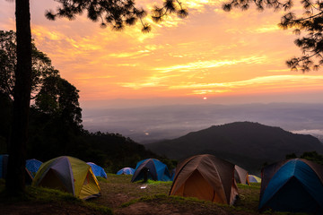 Adventures Camping tourism and tent ,view forest landscape , outdoor in morning and sunset sky at Mon Sone View point , Doi Pha Hom Pok National Park in Chiang Mai, Thailand. Concept Travel.