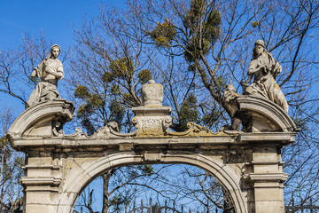 Wall Mural - Double parade gate with baroque pediment and figures of saints to Lviv Greek Catholic Archbishop's Cathedral of Saint George (Ukr: Sobor sviatoho Yura, 1760). Lviv, Ukraine.