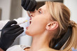 © gpointstudio - Stomatologist giving woman anesthesia in dentist's clinic