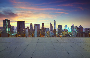 Wall Mural - cityscape sunset view of bangkok modern office business building and high skyscraper in business dis