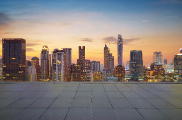 Wall Mural - cityscape sunset view of bangkok modern office business building and high skyscraper in business dis