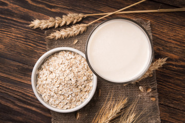 Wall Mural - A glass of oat milk and cereal oatmeal