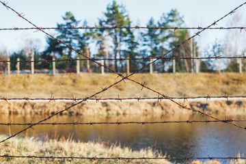 dangerous area fenced with barbed wire fence