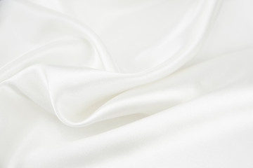 the texture of the satin fabric of white color for the background