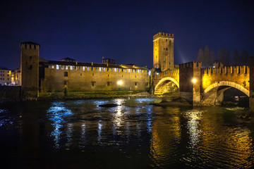 Wall Mural - Verona, Italy – March 2019. Castelvecchio Bridge, Brick & marble bridge with 3 spans & arches, built in the 14th century & reconstructed after WWII. Verona, Italy, Europe