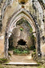  Ancient stone ruins in a leafy garden of Sintra
