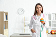 © Pixel-Shot - Portrait of female nutritionist in her office