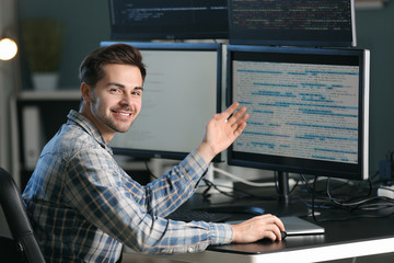 Male programmer working in office