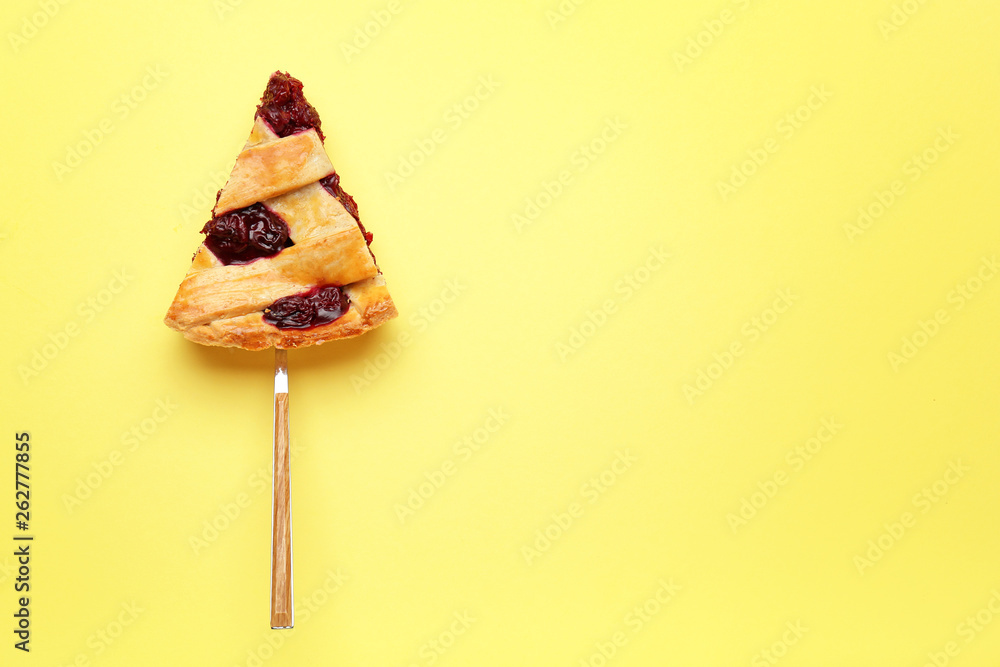 Piece of tasty cherry pie on color background