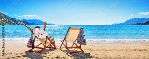 Woman Enjoying Sunbathing at Beach Wallpaper Mural