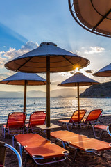 Poster - Sun beds and beach umbrellas