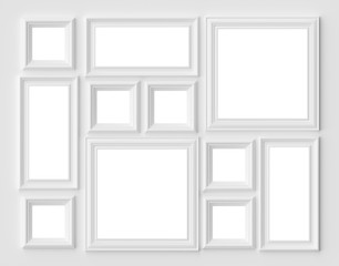 Wall Mural - White picture or photo frames on the white wall with copy-space