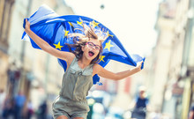 Cute Happy Young Girl With The Flag Of The European Union