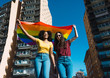 © Luis Mario Hernandez/ADDICTIVE STOCK - Lesbian couple celebrating with LGBT flag on gay pride day