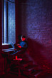 © Bonninstudio/Stocksy - Actor reviewing script sitting in theatre.