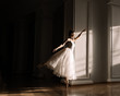 © Alexandr Ivanets/Stocksy - Ballerina in white dress dancing
