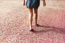Anonymous Girl Tip Toeing Through Flower Petals