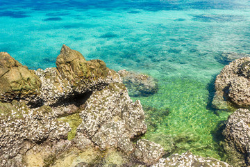 Sticker - Tropical island rock on the beach with blue sky. Koh kham pattaya thailand.