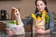 © Artem - Woman chooses a paper bag with food and refuses to use plastic. Concept of environmental protection