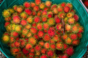 Healthy fruits rambutans background, Red Healthy fruits rambutans, rambutans in a supermarket 