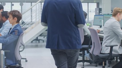 Wall Mural - Diverse Team of Business Managers and Specialists Work on Desktop Computers with Two Rows of Tables Side by Side. Young and Motivated Business people in Modern Open Office.