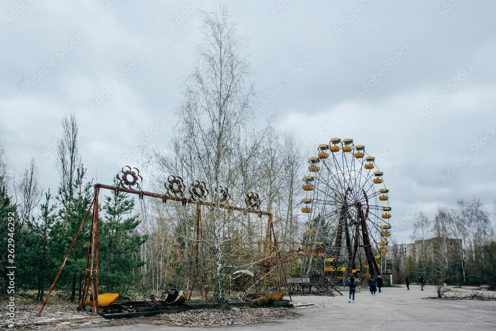 Abandoned carousel and abandoned ferris at an amusement park in the ...