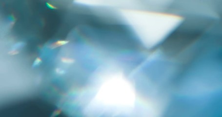 Wall Mural - Sparkling Diamond Highlights. Loop. The light passes through the facets of a slowly rotating diamond and creates repetitive sparkling highlights and rainbow colors