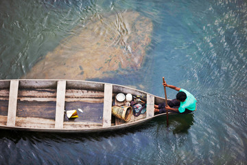 MEGHALAYA, INDIA, September 2018, Boatman rows his boat at Umngot River, Dawki.