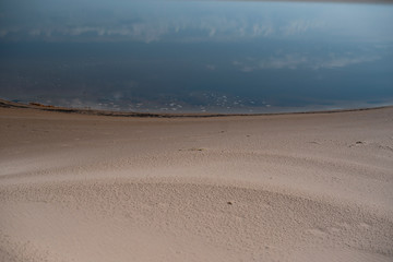 Canvas Print - Sand beach. curved coastline