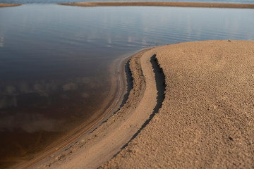 Canvas Print - Sand beach. curved coastline