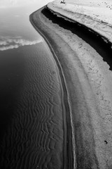 Canvas Print - Sand beach. curved coastline