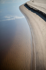 Canvas Print - Sand beach. curved coastline
