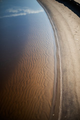 Canvas Print - Sand beach. curved coastline