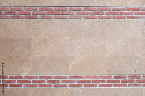 New Polished Stone Cladding And Decorative Red Bricks On Wall