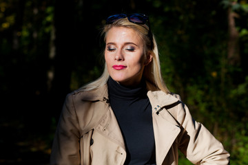 Happy young fashion woman in autumn forest