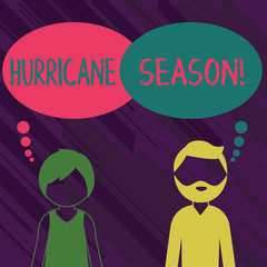 Conceptual hand writing showing Hurricane Season. Concept meaning time when most tropical cyclones are expected to develop Bearded Man and Woman with the Blank Colorful Thought Bubble