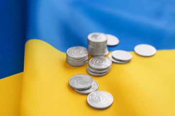 Ukrainian money on national flag, closeup view