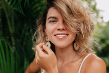 European Happy Woman With White Teeth And Green Eyes Wearing Earnings Looking At Camera With Wonderful Smile