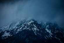 Misty Fog Covered Snowy Mountain Of The Sierra Nevada Range. This Moody Capture Shows The Dark And Majestic Aura Of The Tall Mountain Peaks Found In Eastern California Near Mammoth Lake