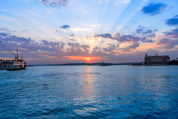 Wall Mural - Istanbul, Turkey, 10 June 2007: City lines ferry, Sunset at Kadikoy