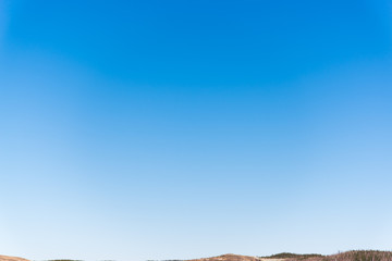 clear sky without clouds, light blue sky above the horizon without clouds for the background