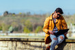 © qunica.com - Educated businessman in the city working remotely from the park
