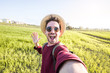 © Davide Angelini - Happy man taking a selfie in the countryside at vacation