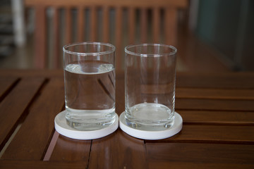 glass of water on wooden table